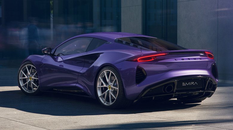 Rear 3/4 view of a purple Lotus Emira