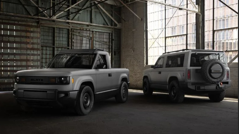 Two gray slate vehicles parked in a warehouse