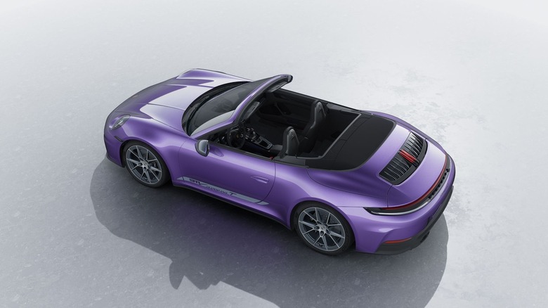 Rear 3/4 view of a purple Porsche 911 Carrera T cabriolet