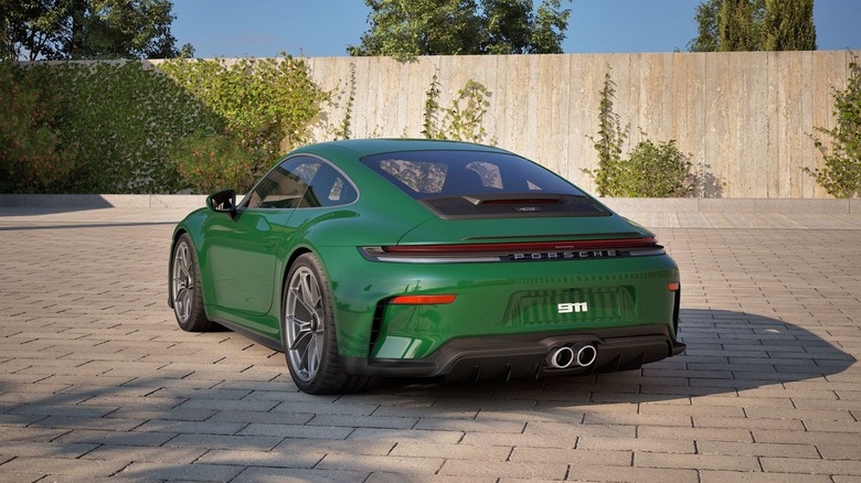 Rear 3/4 view of a green Porsche 911 GT3 Touring