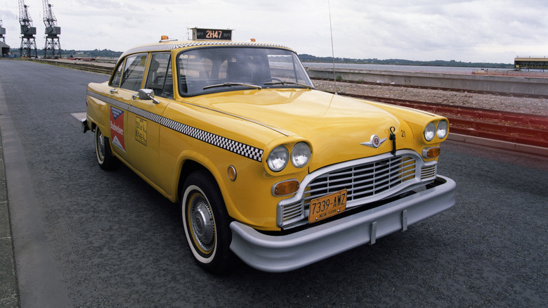 Checker A11 cab, 1980. A yellow New York taxicab. Checker Motors was founded by Morris Markin, a Russian immigrant, in 1922 in Illinois. In 1923 the first Checker taxicab rolled off the assembly line.The company would later become the Checker Motors Corporation. The last cab was made in 1982.