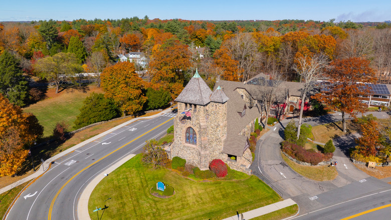 An aerial view of the First Parish Church in fall, at 349 Boston Post Road, Weston, MA.