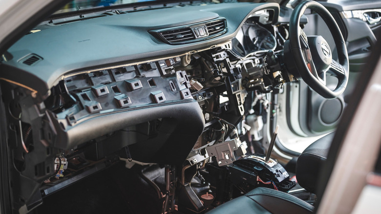 Disassemble car dashboard to air conditioning evaporator repair and service.