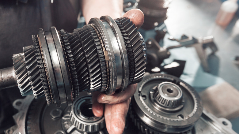 Cross-section of a car gearbox. mechanic work in the garage.