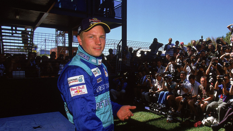 Sauber driver Kimi Raikkonen faces the photographers before the Formula One Australian Grand Prix at Albert Park in Melbourne, Australia
