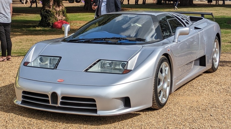 A front three-quarters view of a silver Bugatti EB110 SS