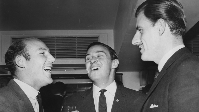 Stirling Moss, Jim Clark and Graham Hill share a joke at the Savoy Hotel in 1964