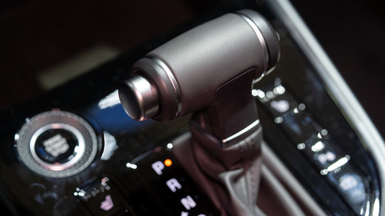 A close-up of an automatic gear shift in park.