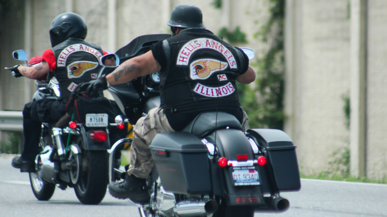 Two men on harley bikes sporting Hell's Angels vests for Illinois