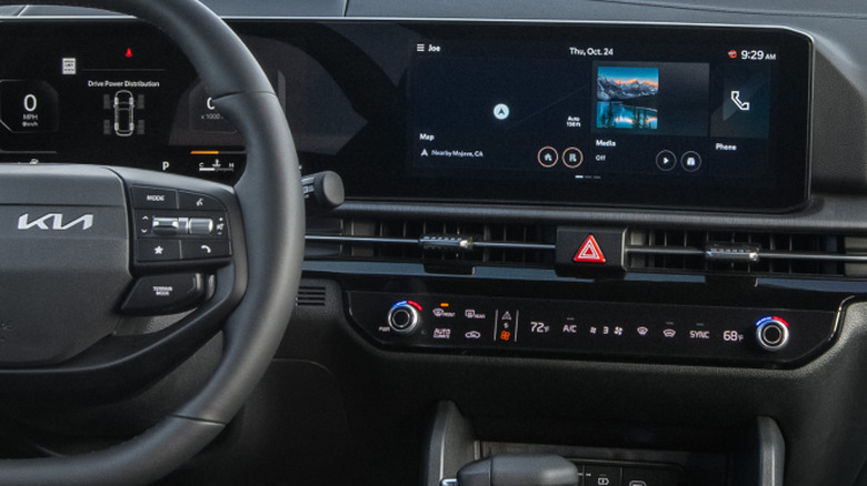 A close-up of the center console of a 2026 Kia Sportage showing its row of touch-sensitive climate control "buttons"