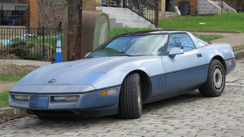 A light blue 1984 Chevrolet Corvette photographed in Pittsburgh, Pennsylvania.