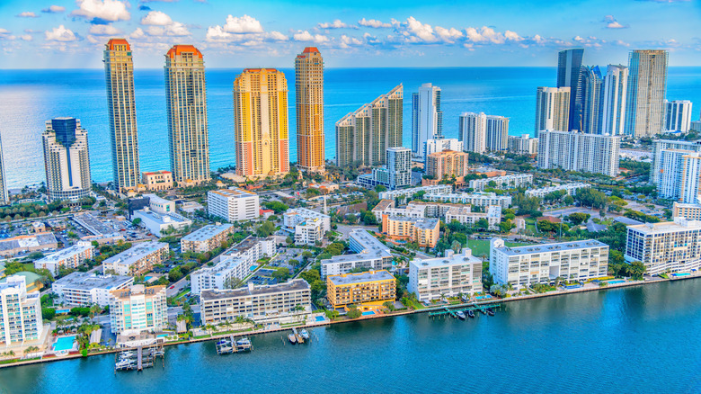 Multiple coastal hotels, resorts, and condominiums along Sunny Isles Beach between Fort Lauderdale and Miami shot via helicopter from an altitude of about 900 feet.