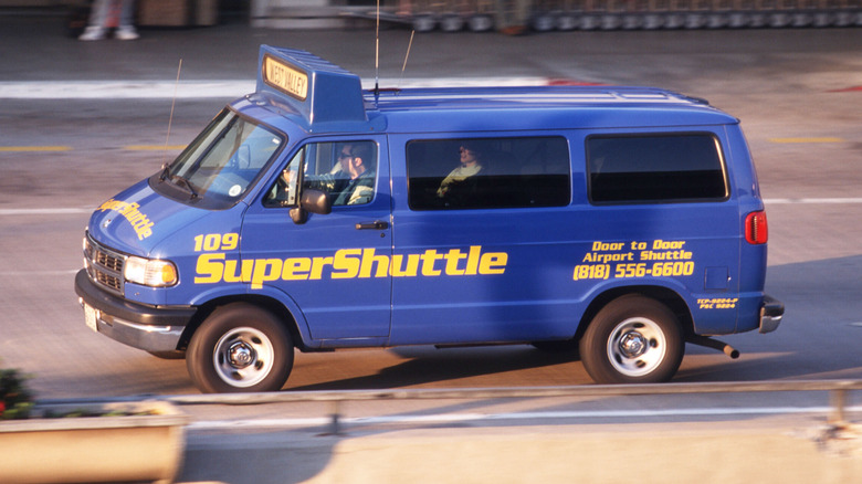 A shuttle bus transports passengers to and from Los Angeles International Airport December 15, 1997 in Los Angeles, CA. A primary goal of the LAX Master Plan process is to explore ways that the region can meet projected needs for air transportation while balancing those needs with the concerns of airport area communities.