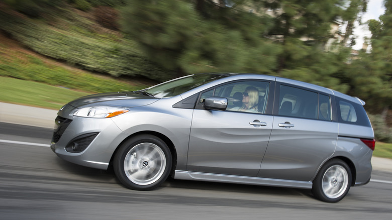 A metallic Mazda5 from nan side