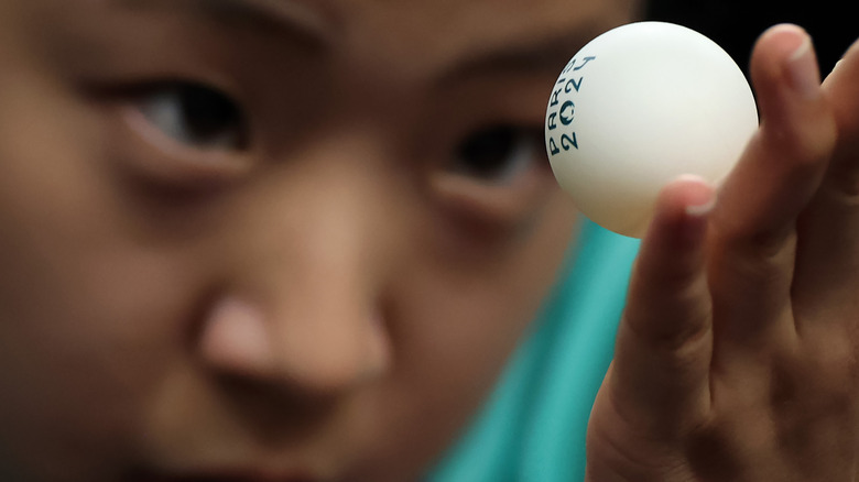 Korea's Yubin Shin holds a ping pong ball during the 2024 Paris Olympics