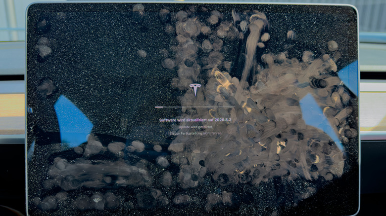 A car's touchscreen covered in fingerprints