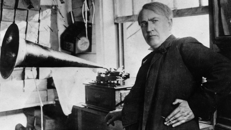 Thomas Edison standing with a phonograph