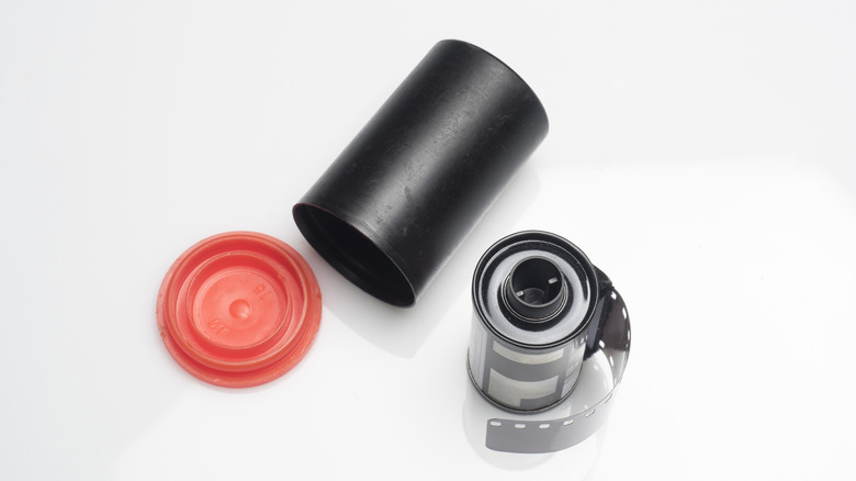 Stock image of a roll of film and an empty film cannister