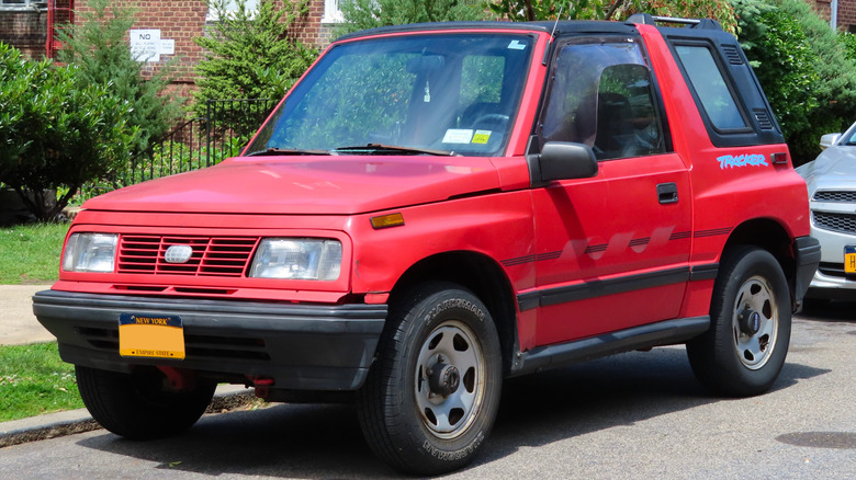 A red 1994 Geo Tracker Convertible photographed in Kew Gardens Hills, Queens, New York, USA