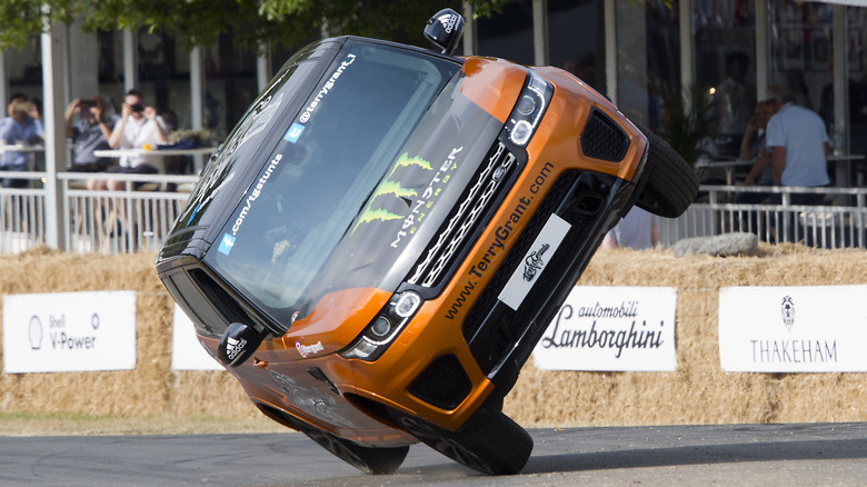 CHICHESTER, ENGLAND - 14th July : Range Rover SVR driven by stunt driver Terry Grant on two wheels at Goodwood on July 14th, 2018 in Chichester, England. (Photo by Michael Cole/Corbis via Getty Images)