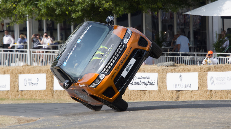 CHICHESTER, ENGLAND - 14th July : Range Rover SVR driven by stunt driver Terry Grant on two wheels at Goodwood on July 14th, 2018 in Chichester, England. (Photo by Michael Cole/Corbis via Getty Images)