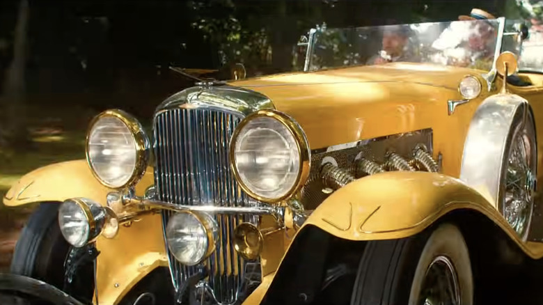 A big yellow pre-war car from the movie The Great Gatsby