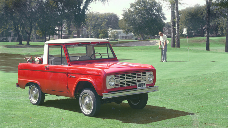 A red first generation Ford Bronco