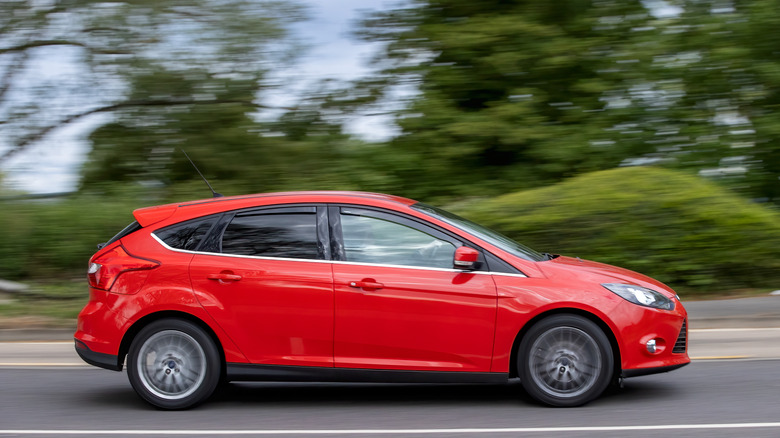 Milton Keynes,Bucks,UK - May 6th 2026: 2014 red Ford Focus car driving on a British road