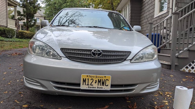 A gray Toyota Camry parked in a driveway