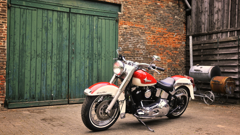 An Harley-Davidson in front of a garage door
