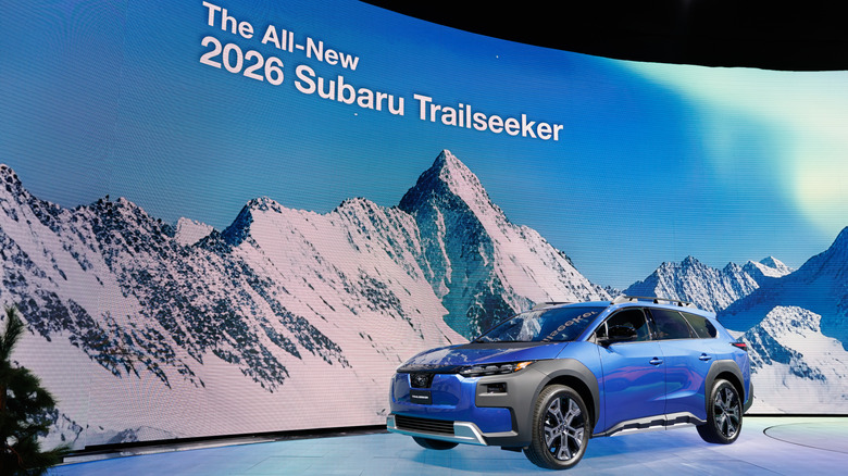 A blue Nissan Trailseeker at an auto show
