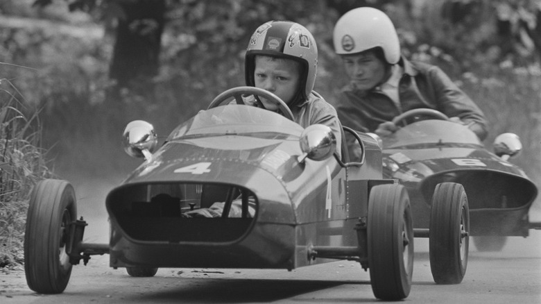 Seven-year-old Thomas Barnard in a car built by his father in a race of the Junior Racing Car Club meeting in Maidstone, Kent, 3rd June 1967.