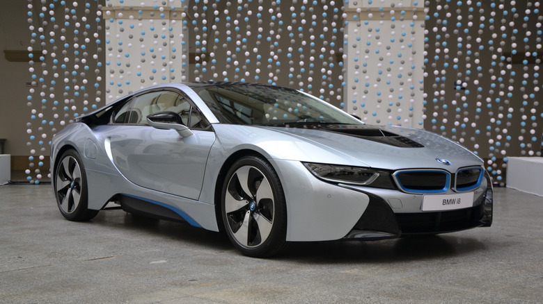Ujazdowski Castle, Warsaw, Poland – May 12th, 2014: Presentation of a plug-in hybrid supercar BMW i8. This car have maximum output of 362 HP and peak torque of 320 Newton metres at the rear wheels and 250 Newton metres at the front, provides all-wheel-drive. The BMW i8 accelerates from 0 to 60 mph in 4.4 seconds.