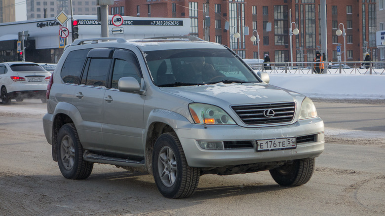 Novosibirsk, Russia - February 05 2021: private silver gray metallic japanese big frame luxury SUV Lexus GX 470, popular USDM US-spec car crossover exported from USA on the winter street