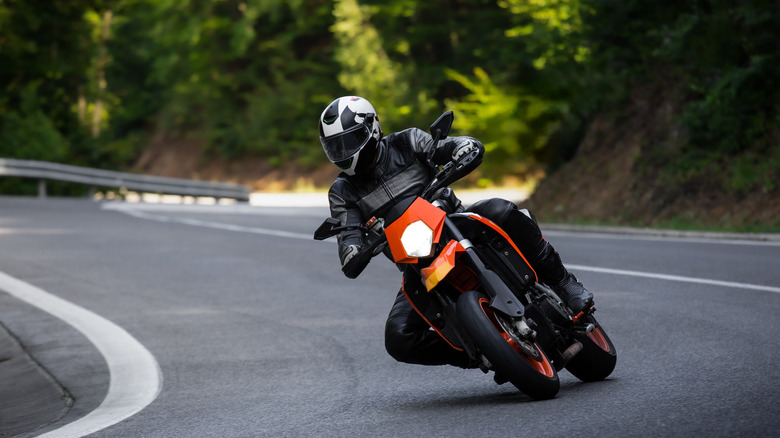 motorcycle driving down a mountain road