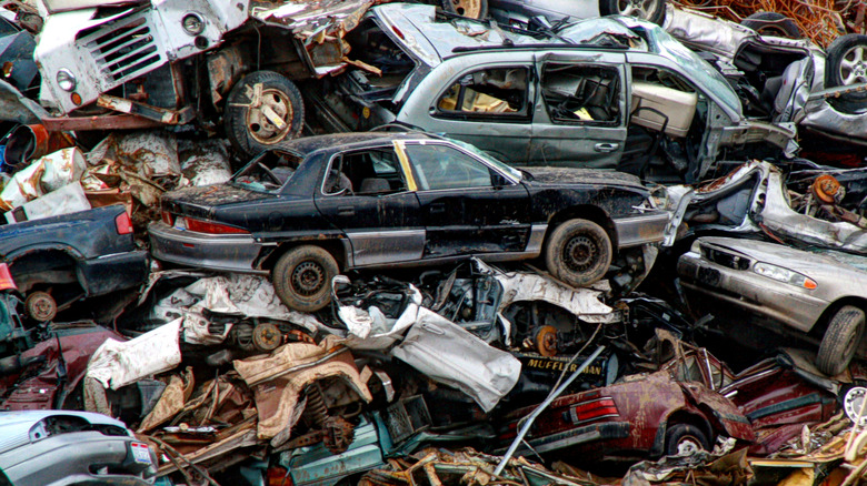 [UNVERIFIED CONTENT] This pile of rusty old cars was in a roadside junkyard in northern Ohio. The stacked cars are in the process of recycle.