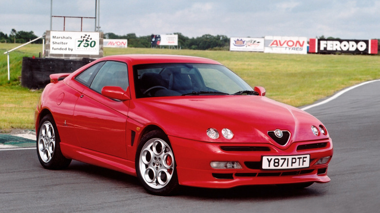 Front 3/4 view of a red Alfa Romeo GTV