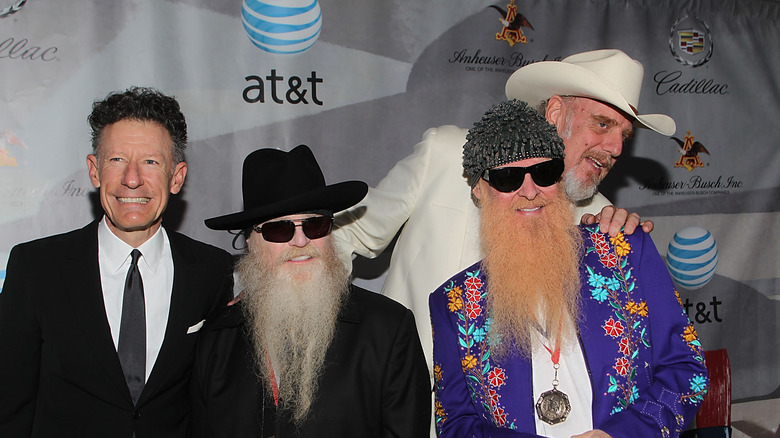 The band ZZ-Top standing for photos at a Cadillac event