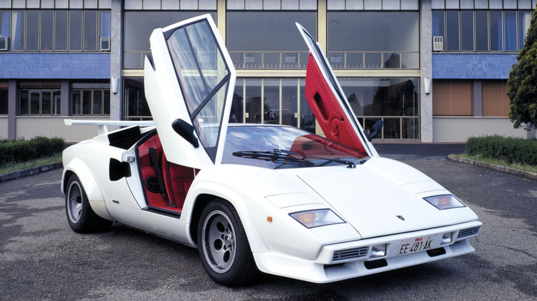 Lamborghini Countach parked in front of Lamborghini headquarters