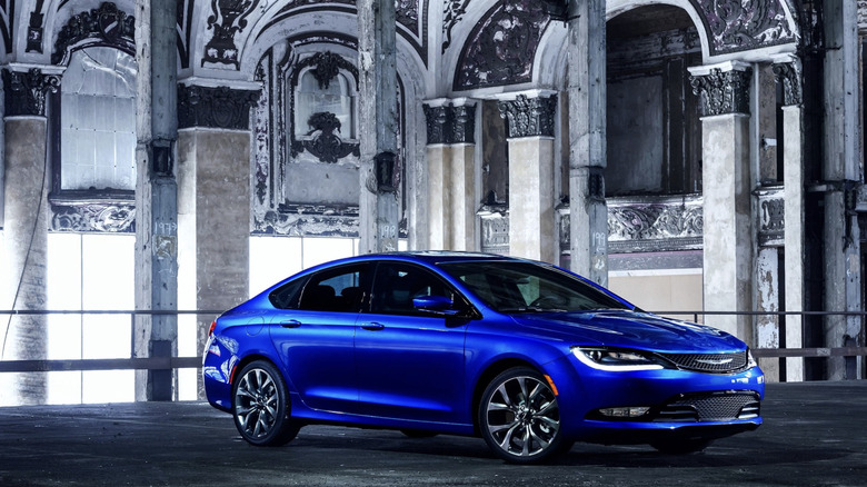 A blue chrysler 200 parking in a parking garage that was once a theater