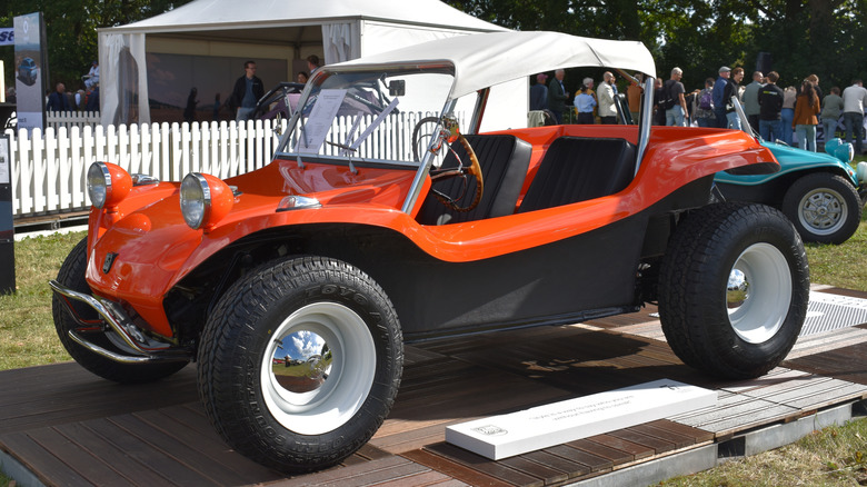 Beesd, the Netherlands - September 12, 2025: a classic orange Meyers Manx buggy