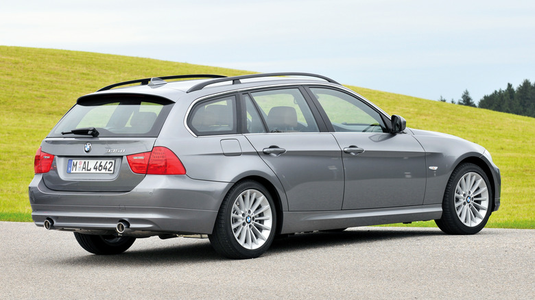Rear 3/4 view of a gray BMW 335d Touring