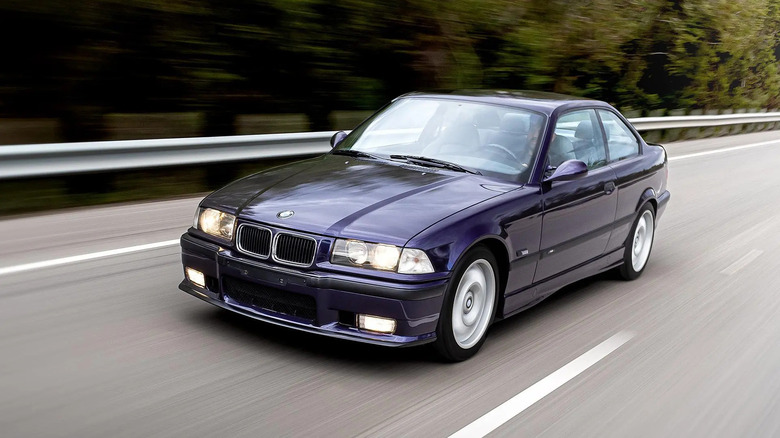 Front 3/4 view of a purple BMW M3