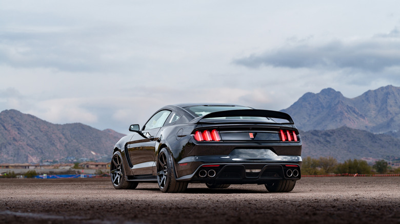 Back end of a Mustang GT350R parked in front of some mountains