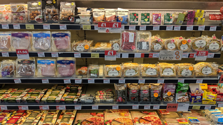 snacks, pies, Cornish pasties, ham, ready meals and pizzas on shelves in a fridge at Euro Garages, Rivington Services on the M61 motorway