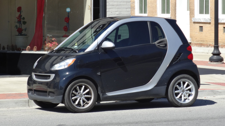 A black Smart car