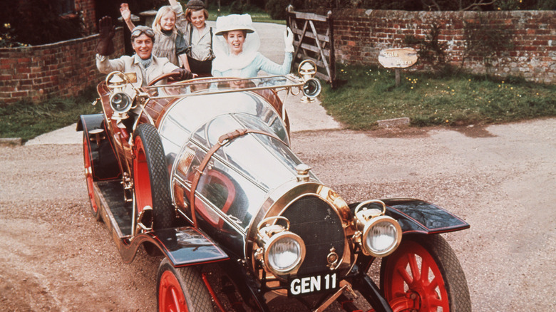 A scene from Chitty Chitty Bang Bang featuring the car and the cast