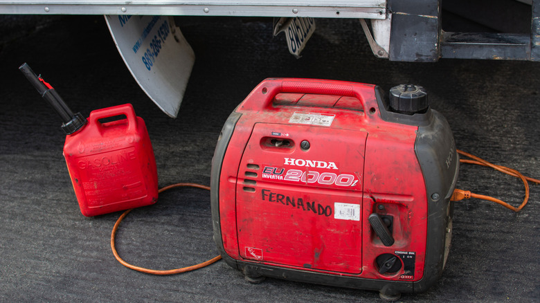Honda power generator sitting on black top