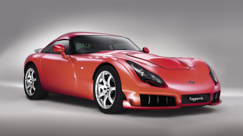 Front 3/4 view of an orange TVR Sagaris in a studio