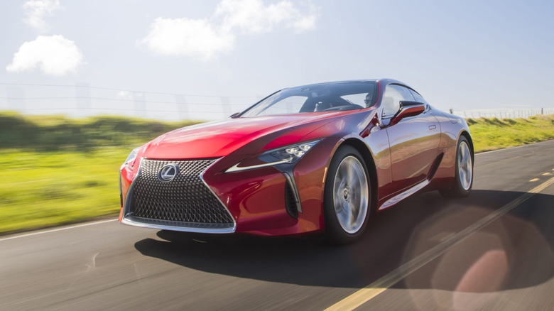 Front 3/4 view of a red Lexus LC 500 coupe driving